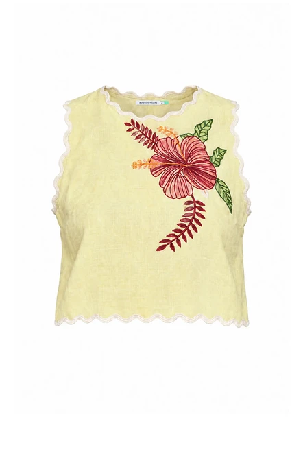 Cut from premium linen, this lemon crop top is finished with scalloped embroidery following the neckline and armholes. A concealed zip at the centre back keeps the line clean. Wear it with the matching yoke midi skirt to a summer wedding, or with denim and bright jewellery. True to size, designed from a 6 to a 22.