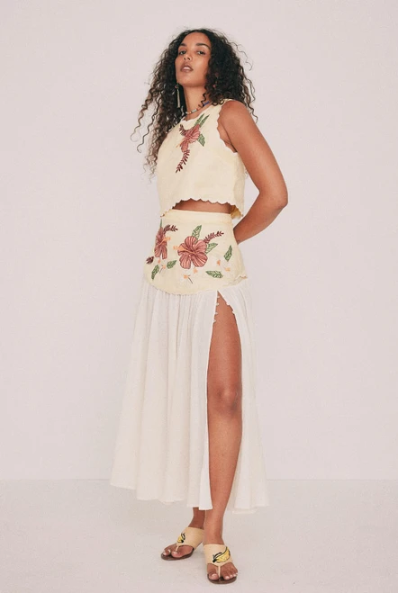 Cut from soft cotton crepe, this cream midi skirt falls from a fitted linen yoke carrying hand-drawn Paloma embroidery. A high split, fastened with buttons, lends movement, while a concealed zip sits at the centre back. The skirt that makes a plain white tee look considered, or choose to style it with the coordinating top and wear it to a summer wedding. This one won't last, add to cart before it's gone. Designed from a 6 to a 22.