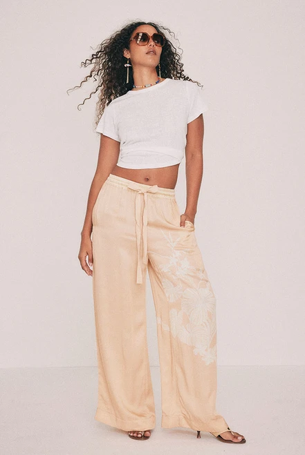 Cut from fluid viscose satin, this cream pant is placement printed with the Kai design drawn in our Central Coast studio. An elasticated waist, relaxed leg and pockets set into the side seams ensure it is as practical as it is comfortable. Wear it with the matching slip top for dinner, with golden accessories and a basket bag. Designed from a 6 to a 22.