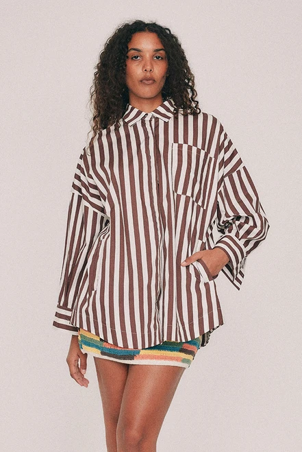 Cut from crisp cotton poplin, this oversized striped shirt is finished with a classic collar, long cuffed sleeves and a patch pocket at the chest and practical pockets to the sides. Wear it buttoned and tucked through the week, or open over everything on a Saturday. Intended to be oversized, so size down for a closer fit. Designed from a 6 to a 22.