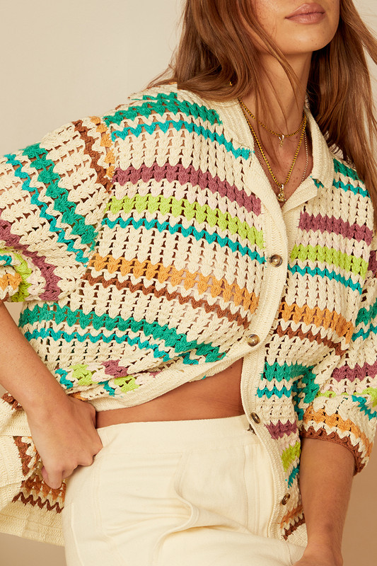 Each season Bohemian Traders creates a capsule of crochet hand crafted by artisans in India. With a color palette borrowed from '70s California this crochet-knitted shirt threads a kaleidoscope of stripes into a wardrobe masterpiece. Dropped shoulders and chunky tort buttons mean you can wear this anywhere.