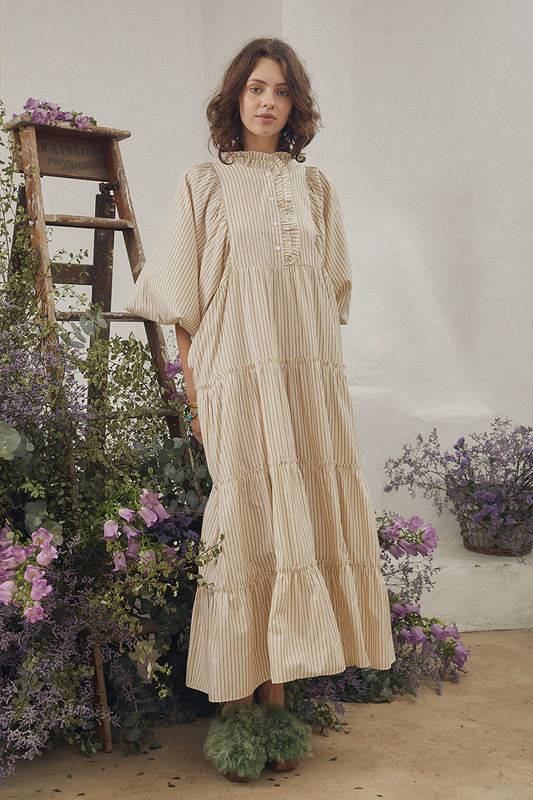 Celebrate the arrival of summer with Bohemian Traders famed Boho Midi Dress. Cut from breathable cotton and patterned with lemon and cafe stripes, it's relaxed sillhouette makes it perfect for easy days spent seaside. Pintucks to the yoke and tiers finished with ruffles make this striped dress just as suited to lunch at the resort as covering up when heading to and from the beach.

Circular product. Natural fibre.