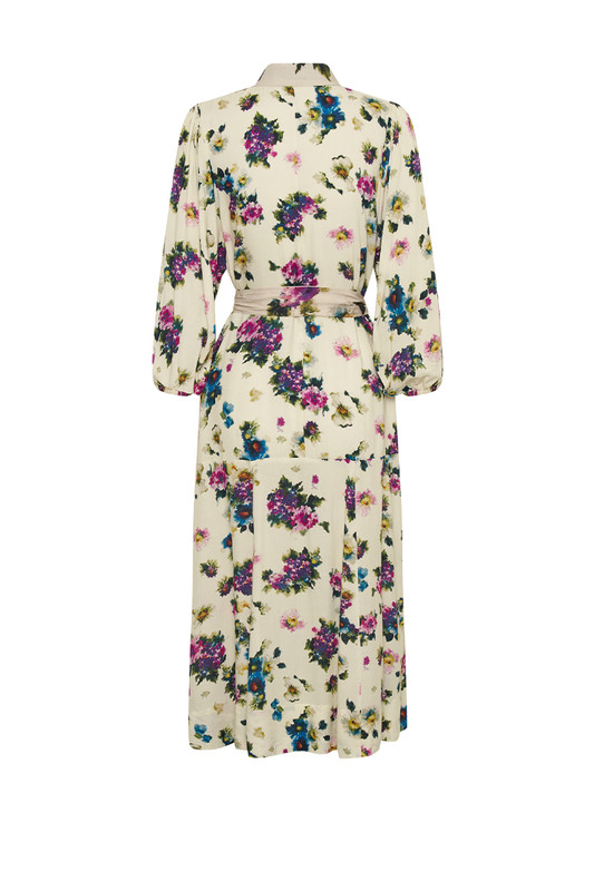 Bohemian Traders Drop Waist Midi Dress is beautifully patterned with vintage florals. Made from breathable rayon, it has dolman sleeves and a contrast sash that cinches the shape. Match your accessories to one of the colors in the print.