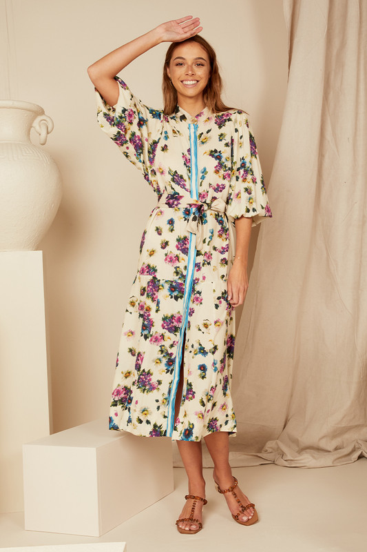 Bohemian Traders Drop Waist Midi Dress is beautifully patterned with vintage florals. Made from breathable rayon, it has dolman sleeves and a contrast sash that cinches the shape. Match your accessories to one of the colors in the print.