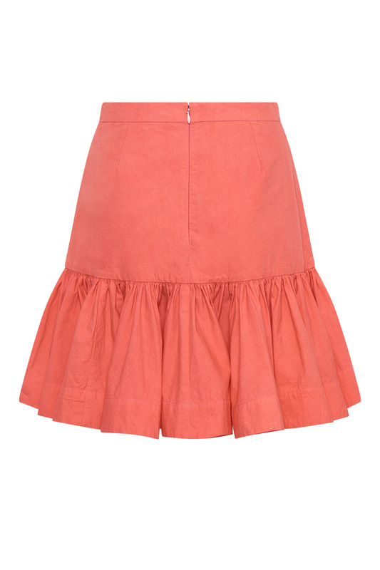 This mini skirt is a new shape for the Bohemian Traders customer and is cut in a fun and flouncy shape with fixed dropped yoke. Made from cotton poplin in an uplifting guava hue, it's best when paired with the co-ordinating oversized shirt.