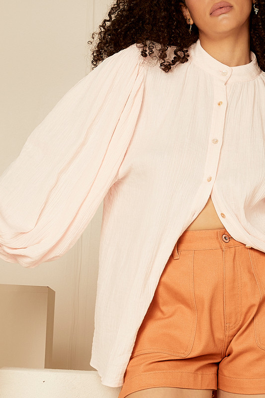 This delicate blouse is cut from 100% cotton gauze and is gathered in a way that shows off how beautifully floaty it is. Style yours with denim shorts and espadrilles for al fresco lunches.