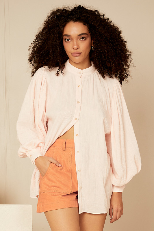 This delicate blouse is cut from 100% cotton gauze and is gathered in a way that shows off how beautifully floaty it is. Style yours with denim shorts and espadrilles for al fresco lunches.