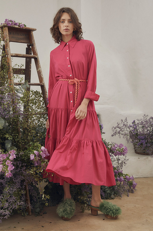 Bohemian Traders slim fit shirt dress is made from lightweight cotton-voile in a mood-boosting fuchsia colourway, styled with a contrasting coral rope belt. It's cut for a slim for through the bodice and is enhanced by the tiered midi skirt.