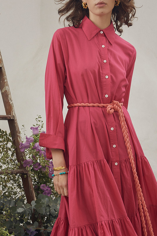 Bohemian Traders slim fit shirt dress is made from lightweight cotton-voile in a mood-boosting fuchsia colourway, styled with a contrasting coral rope belt. It's cut for a slim for through the bodice and is enhanced by the tiered midi skirt.