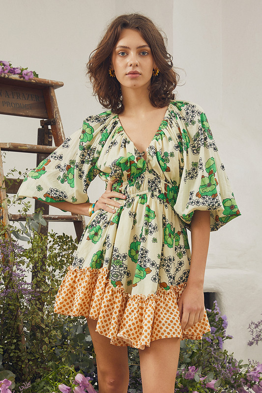 Bohemian Traders size inclusive Peridot Floral Mini Dress is cut from lightweight voile in a flouncy shape with an elasticated waist and blouson sleeves, making it the perfect summer dress. The in-house designed, vintage inspired print features lime florals printed in clusters and a contrasting rust polkadot.