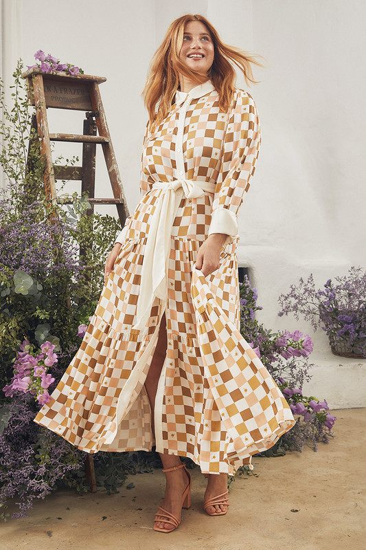 This A-line maxi dress is printed with a tonal check in autumnal shades of coral and brown and scatterd with a delicate honey bee. It's cut from weighty satin crepe that skims your frame and has a decadent ruffled skirt. Wear yours with mules and a tote.