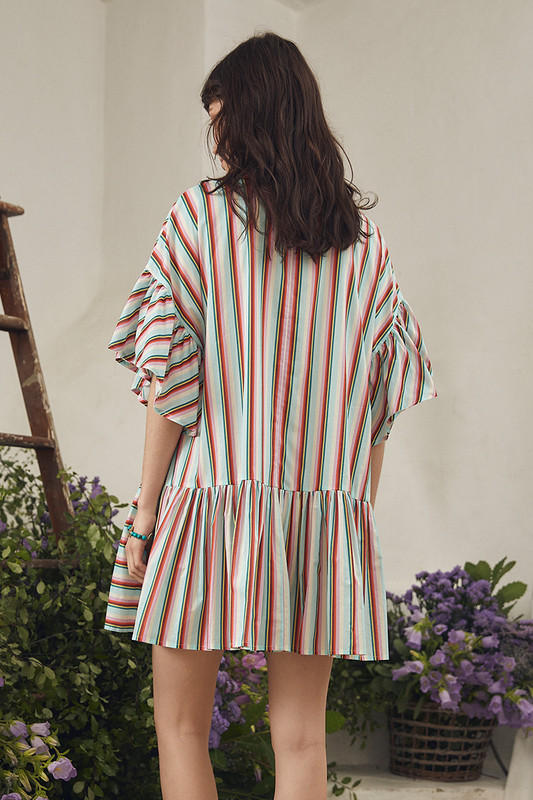 Make dressing easy with the Bohemian Traders Genoa Mini Dress in this elevated in-house designed 'skyline' stripe. Asymmetric ruffles cascade playfully on this boxy-shaped dress, a true crowd favourite. Embrace its versatile simplicity by pairing it with strappy sandals on warm days and layer with jeans as the weather cools.