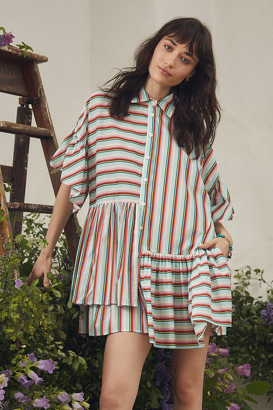 Make dressing easy with the Bohemian Traders Genoa Mini Dress in this elevated in-house designed 'skyline' stripe. Asymmetric ruffles cascade playfully on this boxy-shaped dress, a true crowd favourite. Embrace its versatile simplicity by pairing it with strappy sandals on warm days and layer with jeans as the weather cools.