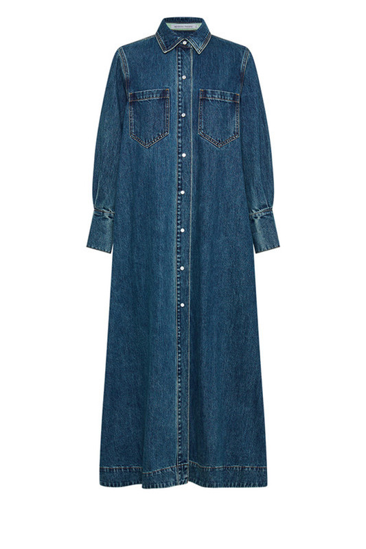 We've put our Bohemian Traders spin on classic workwear to create this blue denim shirt dress, which features a detachable self belt. It has a slimmer fit than it's Opera Shirt Dress companion. 