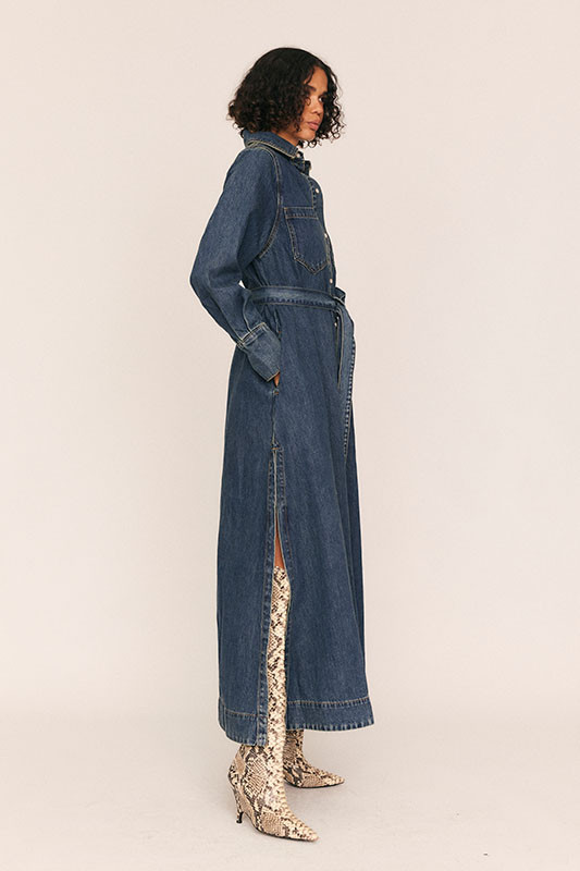 We've put our Bohemian Traders spin on classic workwear to create this blue denim shirt dress, which features a detachable self belt. It has a slimmer fit than it's Opera Shirt Dress companion. 
