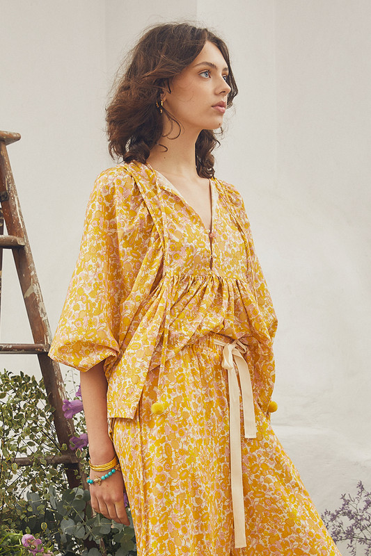 Our Ashbury boho blouse is cut from airy cotton voile and printed with a delicate tonal honey palette. It has a relaxed shape and rouleau ties at the neckline.