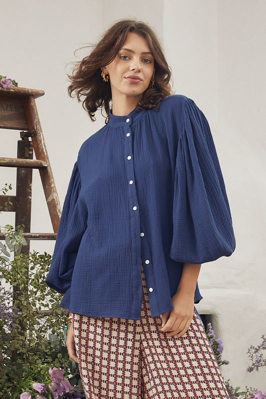 This delicate blouse is cut from 100% cotton gauze and is gathered in a way that shows off how beautifully floaty it is. Style yours with denim or the cubist pant for easy days spent wandering.