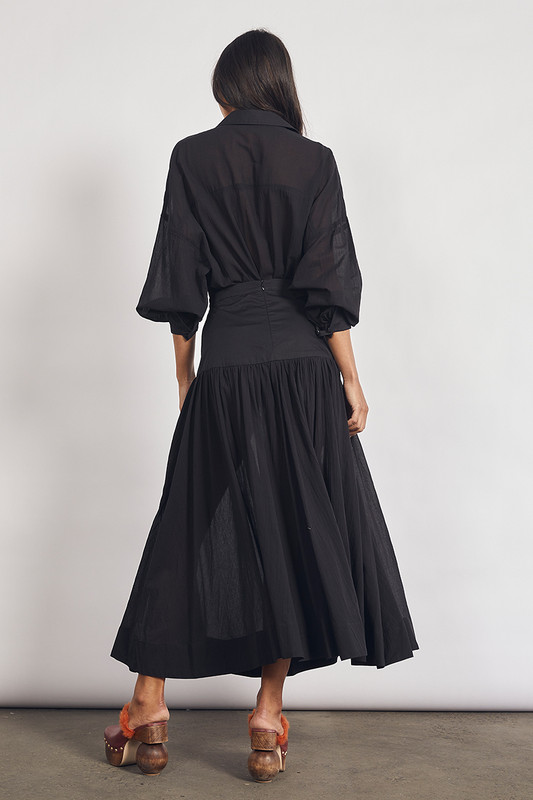 This Ink Yoke Maxi Skirt is a versatile treasure that will work for all kinds of occasions from warm-weather picnics to winter soirees. It's made from lightweight cotton voile and has a yoke-detailed waist and an inky black colour making it feel like a prized vintage piece. Wear yours with the coordinating shirt.