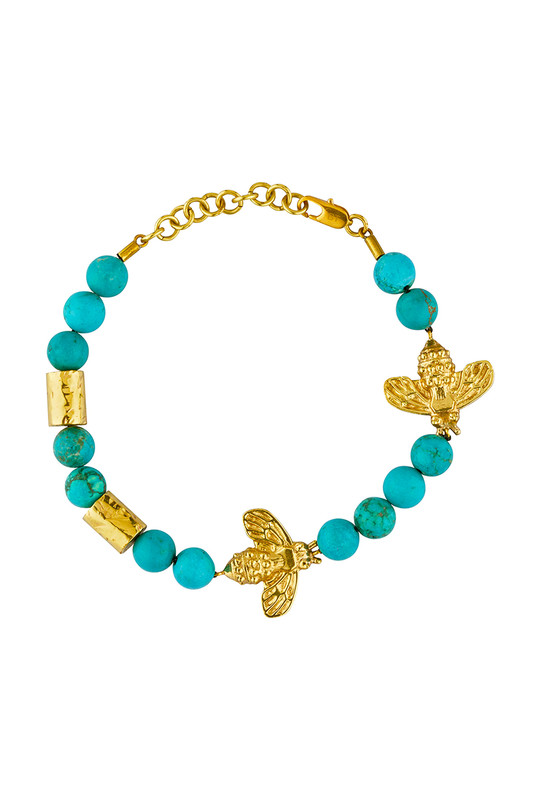 Bohemian Traders incorporates playful motifs into its collections to re-inspire the fun of dressing up. This Bee-Tanical gold-tone bracelet is decorated with playful bee motifs and genuine turquoise spheres. Layer it over the cuffs of your shirt and pair it with the matching necklace.