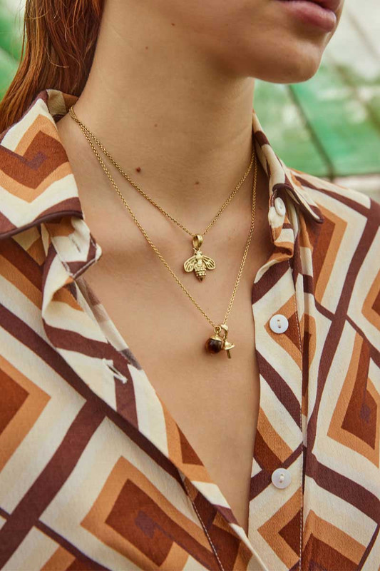 BT's necklace features a hand crafted mushroom pendant alongside a tigers eye sphere. It's crafted from nano plated brass and strung on a 50cm chain.