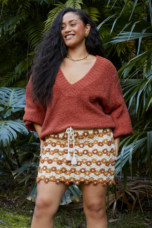 This skirt has been hand-crocheted from soft cotton in a timeless café and cream colorway. Designed to skim the hips, it features tasseled drawstrings for an adjustable fit and a soft woven lining for coverage. Wear yours with everything from an oversized denim shirt to your swimsuit.