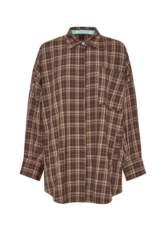 The oversized plaid shirt in a rich brown check is your go-to for laid-back layering. Cut from a soft, mid-weight fabric with drop shoulders and full sleeves, it’s perfect worn open over a dress or buttoned up with jeans for the ultimate casual-cool look.