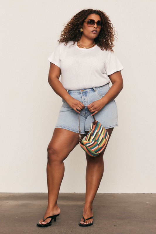 Fresh, fun, and handmade - this cotton crochet mini bag with leather accents brings artisanal charm and effortless style to your everyday wardrobe.