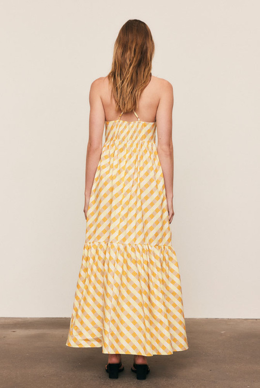 A best-selling silhouette reimagined in sunset hues, the Gingham Slip Dress is crafted from mid-weight cotton with embroidered appliqué detailing. Featuring a fitted bodice, full skirt and gathered back, it flatters with ease and movement. Made from natural fibre for breathable comfort, it’s timeless, feminine, and destined to sell out fast.