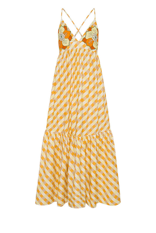 A best-selling silhouette reimagined in sunset hues, the Gingham Slip Dress is crafted from mid-weight cotton with embroidered appliqué detailing. Featuring a fitted bodice, full skirt and gathered back, it flatters with ease and movement. Made from natural fibre for breathable comfort, it’s timeless, feminine, and destined to sell out fast.