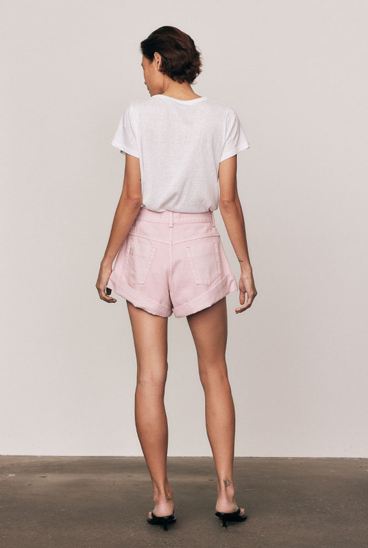 In premium rigid denim, the High Waist Mini Short in Ice Pink offers a feminine twist on a classic silhouette. With its structured A-line shape and high-rise waist, it delivers all-day comfort and confident style. A natural-fibre essential designed for timeless wearability and effortless ease.
