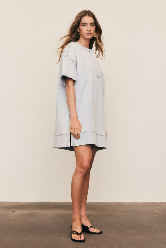 The Oversized Tee Dress combines the ease of denim with the comfort of your favourite tee. Cut from premium stretch denim, it features dropped shoulders, cap sleeves, and a relaxed, boxy fit. A modern essential that’s machine washable, size inclusive, and designed for everyday confidence.