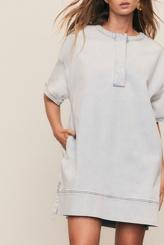 The Oversized Tee Dress combines the ease of denim with the comfort of your favourite tee. Cut from premium stretch denim, it features dropped shoulders, cap sleeves, and a relaxed, boxy fit. A modern essential that’s machine washable, size inclusive, and designed for everyday confidence.