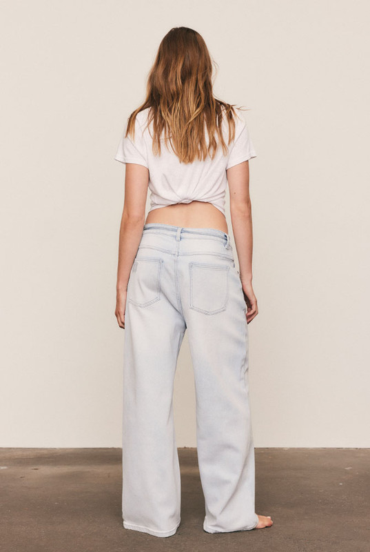 The Baggy Denim Jean delivers modern ease through a wide, slightly cropped leg and relaxed high-waist cut. Crafted from premium stretch denim, it moves with you while maintaining structure and polish. Machine washable and made to flatter every body, this jean is an enduring wardrobe foundation. If you're inbetween sizes, we recommend sizing down