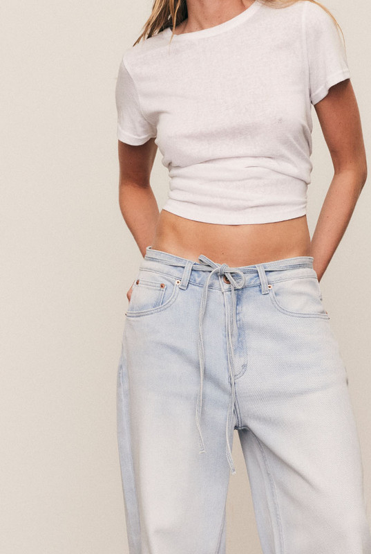 The Baggy Denim Jean delivers modern ease through a wide, slightly cropped leg and relaxed high-waist cut. Crafted from premium stretch denim, it moves with you while maintaining structure and polish. Machine washable and made to flatter every body, this jean is an enduring wardrobe foundation. If you're inbetween sizes, we recommend sizing down