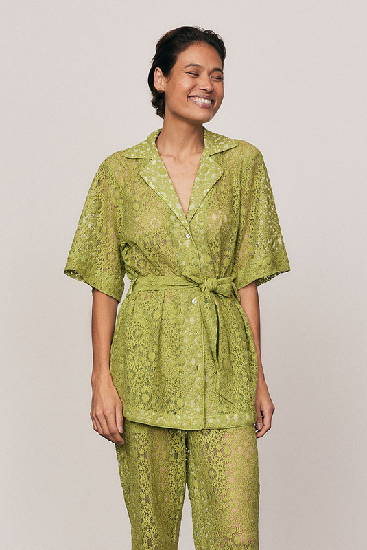 A best-selling Bohemian Traders silhouette, reimagined in vibrant Citron lace. Worn by women of influence globally, this softly structured shirt features a relaxed fit, shell buttons and a self-tie waist. Crafted from a premium cotton blend lace, it delivers effortless elegance and everyday ease. Available in our size-inclusive range from 6–22.