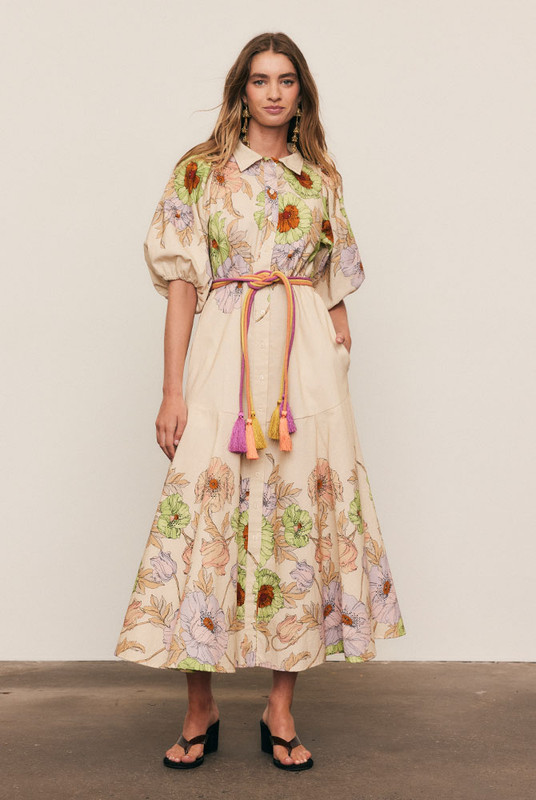 This premium linen blend midi dress is a study in effortless volume and artful print. Intended for a fluid, loose fit, the silhouette is balanced by a classic collar and a smooth button-down front, allowing the fabric to drape beautifully. Voluminous puff sleeves and a flowing midi skirt showcase the custom-designed floral placement print. This is a graceful, seasonless piece that combines comfort with sophistication, ensuring ultimate longevity in your modern capsule wardrobe.