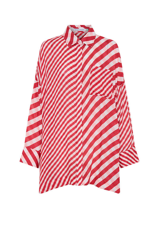 The Gingham Check Shirt is cut from lightweight modal and spliced with Bohemian Traders’ custom print for a bold, elevated finish. The oversized silhouette and classic collar make it endlessly versatile. Pair with the matching Crop Flare Pant for a coordinated festive look defined by natural comfort and modern ease.