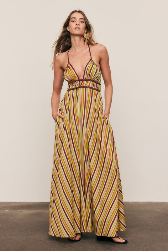 Softly structured and effortlessly refined, the Maggie Stripe Slip Dress is cut from lightweight cotton voile in Bohemian Traders’ custom spliced stripe print. Designed to flatter the body with a gathered underbust, low V-neck and adjustable cross-back straps, it drapes fluidly through the skirt, delivering timeless summer elegance with modern ease.