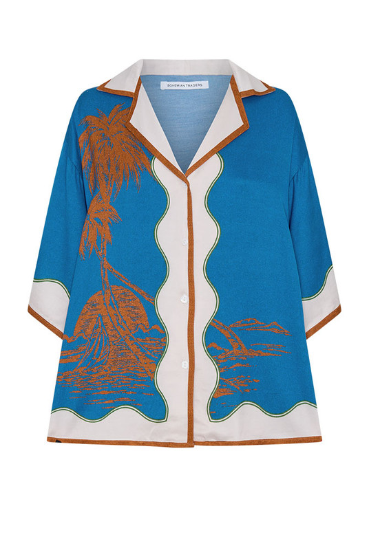 Effortlessly refined, the Kauai Short Sleeve Shirt is crafted from silky viscose satin in Bohemian Traders’ exclusive palm placement print. Featuring a relaxed fit, camp collar and wide sleeves, it drapes beautifully with subtle shine. Pair with the matching Kauai Maxi Skirt for a cohesive, statement-making summer set that moves with fluid ease.