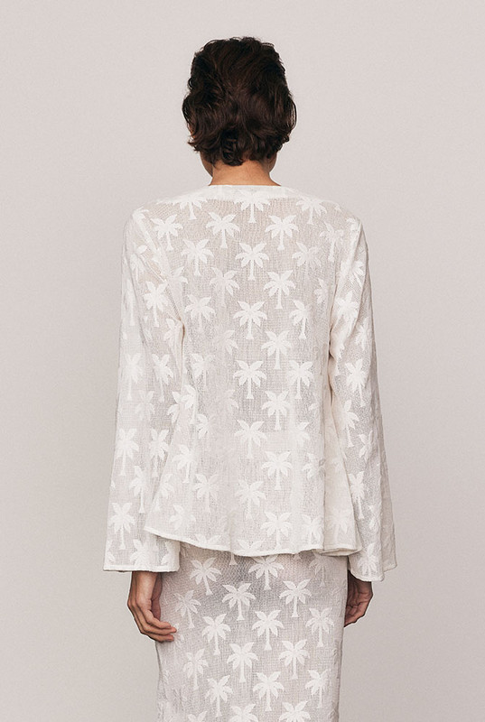 Softly sculptural, the Cotton Lace Swing Top is crafted from a premium cotton-blend knit lace featuring an intricate palm motif. With voluminous sleeves and a gentle swing hem, it blends texture and femininity with ease. A statement in craftsmanship and comfort. Pair with the matching Cotton Lace Maxi Skirt for head-to-toe elegance.