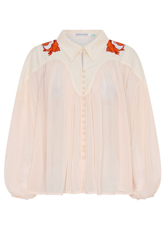 The Carp Blouse balances artistry and ease, featuring a semi-sheer crepe body and solid cotton yoke detailed with Bohemian Traders’ in-house carp print. Voluminous sleeves and a soft drape lend elegance to everyday dressing. A refined piece that layers beautifully from coastal mornings to city evenings.