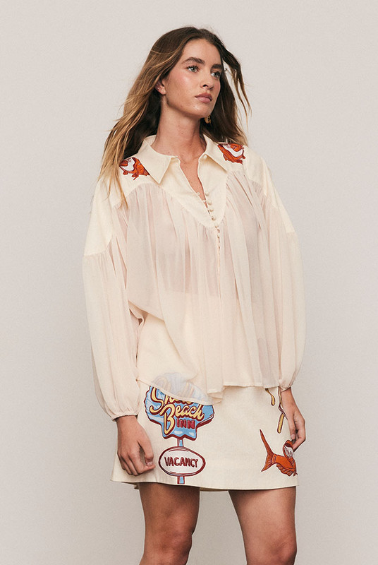 The Carp Blouse balances artistry and ease, featuring a semi-sheer crepe body and solid cotton yoke detailed with Bohemian Traders’ in-house carp print. Voluminous sleeves and a soft drape lend elegance to everyday dressing. A refined piece that layers beautifully from coastal mornings to city evenings.