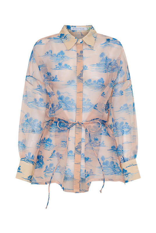 A best-selling Bohemian Traders silhouette, the Calm Island Oversized Shirt is crafted from crisp organza featuring our exclusive palm print. Loved by women of influence globally, it’s designed with wide sleeves and a relaxed drape for effortless movement. Pair with the matching skirt, layer over denim, or wear alone over your swimsuit.