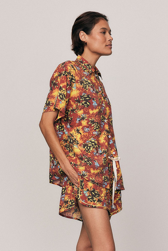 A vibrant staple, the Kai Short Sleeve Shirt is crafted from soft rayon with a custom, in-house all-over print. Its boxy shape and refined collar channel relaxed tailoring for summer days in motion. Pair with the coordinating Kai Sporty Short for an elevated resort set that feels confident, artful, and unmistakably Bohemian Traders.