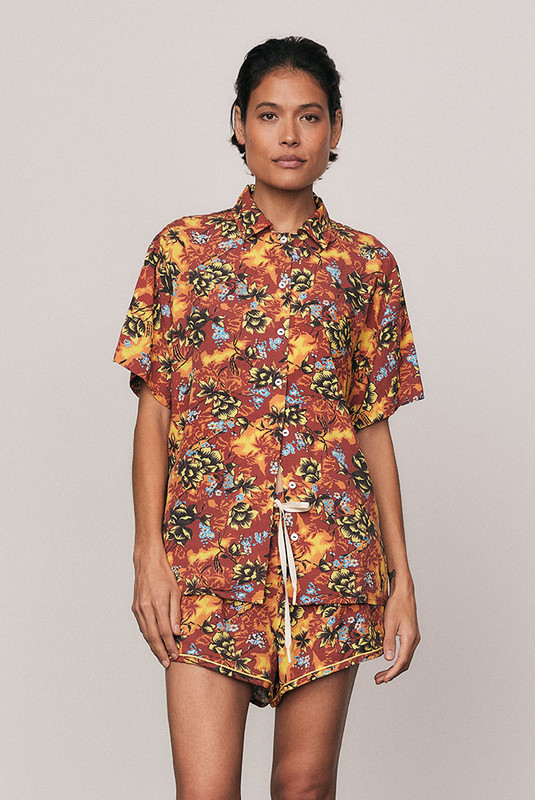 A vibrant staple, the Kai Short Sleeve Shirt is crafted from soft rayon with a custom, in-house all-over print. Its boxy shape and refined collar channel relaxed tailoring for summer days in motion. Pair with the coordinating Kai Sporty Short for an elevated resort set that feels confident, artful, and unmistakably Bohemian Traders.