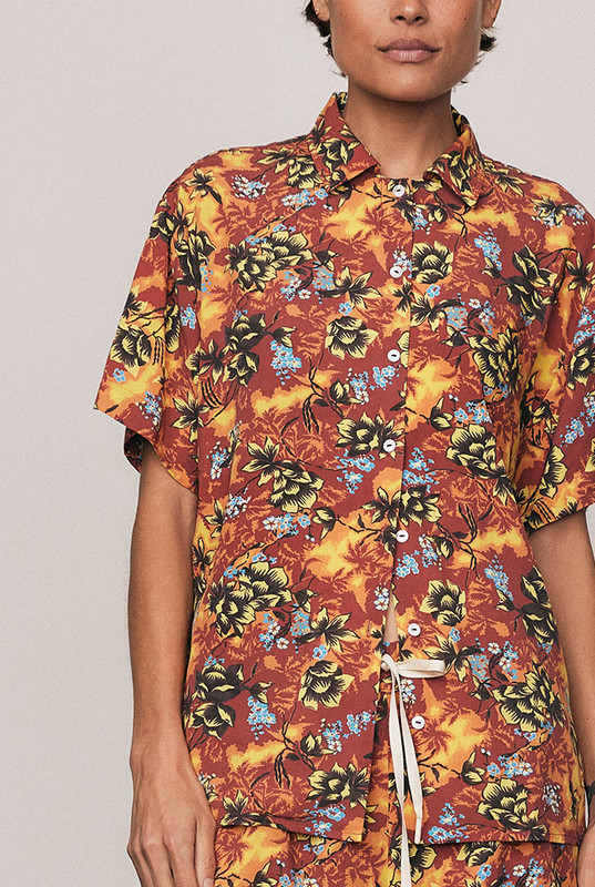 A vibrant staple, the Kai Short Sleeve Shirt is crafted from soft rayon with a custom, in-house all-over print. Its boxy shape and refined collar channel relaxed tailoring for summer days in motion. Pair with the coordinating Kai Sporty Short for an elevated resort set that feels confident, artful, and unmistakably Bohemian Traders.