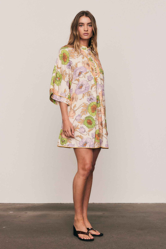 This linen-cotton blend mini dress is defined by its artful, in-house floral print and relaxed tailoring. Designed for a comfortable, breezy fit, its mandarin collar, wide half-length sleeves, and crisp A-line silhouette offer sophisticated simplicity. Piping detail and functional side pockets ensure an elevated utility, making this an effortlessly modern piece for your summer capsule wardrobe.