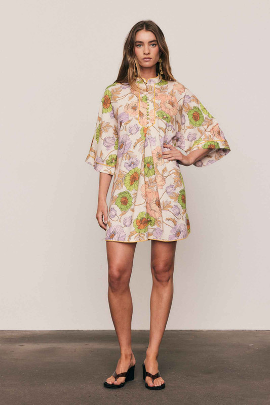 This linen-cotton blend mini dress is defined by its artful, in-house floral print and relaxed tailoring. Designed for a comfortable, breezy fit, its mandarin collar, wide half-length sleeves, and crisp A-line silhouette offer sophisticated simplicity. Piping detail and functional side pockets ensure an elevated utility, making this an effortlessly modern piece for your summer capsule wardrobe.