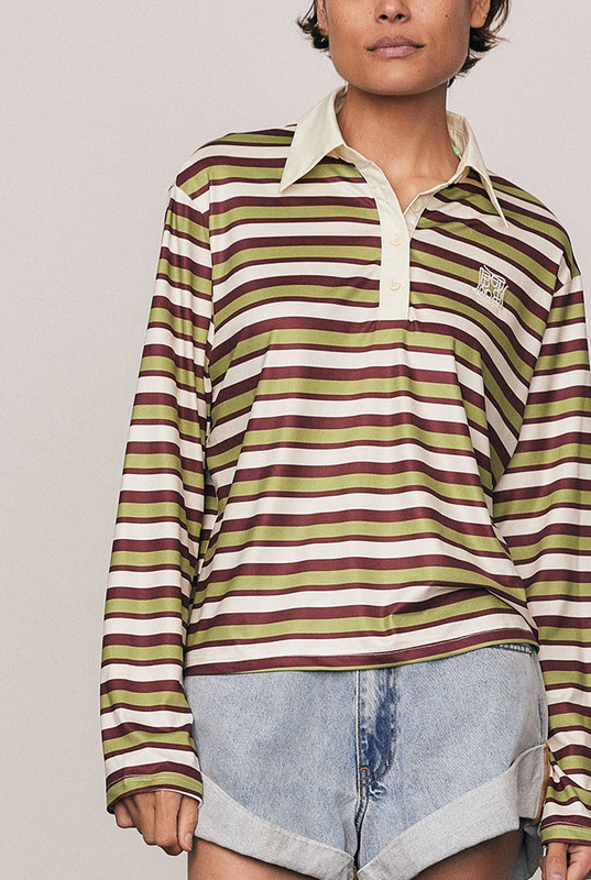 A modern take on an off-duty classic, the Maggie Rugby Tee is cut from soft, slinky polyester in multi-coloured stripes. Designed with a contrast collar, long wide sleeves, and embroidered logo, it blends nostalgic sport styling with everyday dressing. Wear it loose or belted for bold, relaxed refinement that feels unmistakably Bohemian Traders.