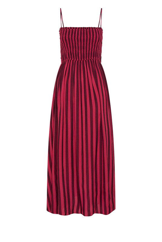 Soft and fluid, the Ruched Slip Maxi Dress is crafted from draped viscose rayon in Bohemian Traders’ custom magenta stripe print. A ruched bodice flatters the form before flowing into an A-line skirt that moves with ease. Effortless femininity meets artful design - a timeless piece for long lunches, warm evenings, and summer celebration.